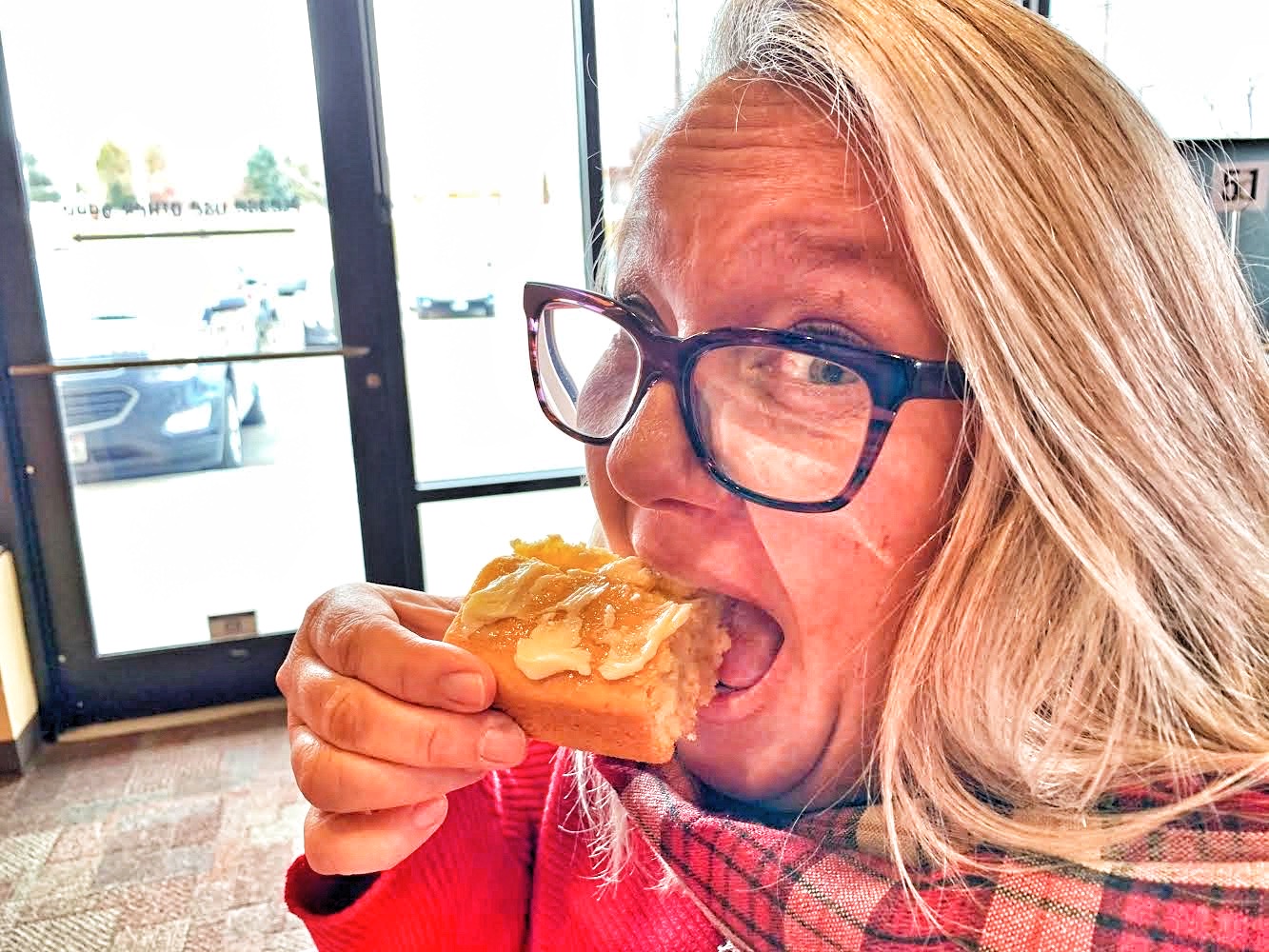 Lori Ringle Sampling the Cornbread at Porky Butts BBQ.