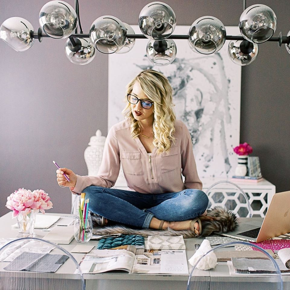 interior designer sitting on a table working