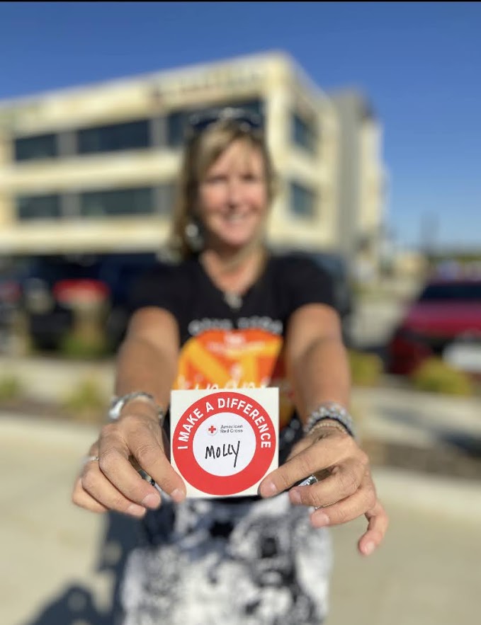 blood donor showing her sticker
